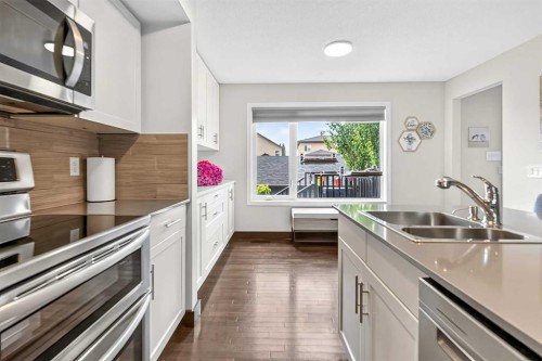 102 Panatella Hill Nw, Calgary, AB - Indoor Photo Showing Kitchen With Double Sink