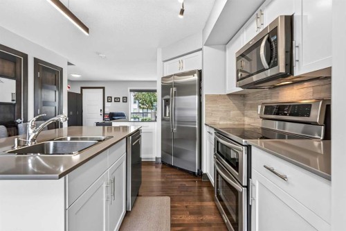 102 Panatella Hill Nw, Calgary, AB - Indoor Photo Showing Kitchen With Double Sink With Upgraded Kitchen