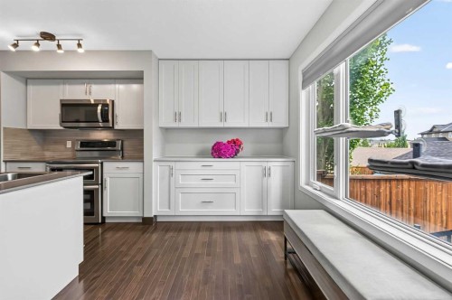 102 Panatella Hill Nw, Calgary, AB - Indoor Photo Showing Kitchen With Double Sink