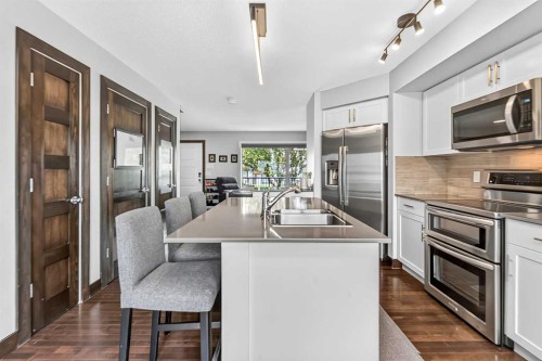 102 Panatella Hill Nw, Calgary, AB - Indoor Photo Showing Kitchen With Double Sink With Upgraded Kitchen