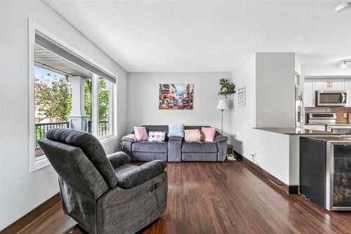 102 Panatella Hill Nw, Calgary, AB - Indoor Photo Showing Living Room