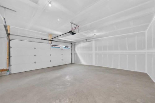 405-81 Midtown Boulevard Sw, Airdrie, AB - Indoor Photo Showing Garage