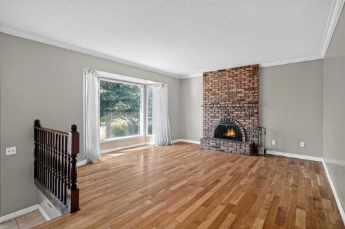 6724 22 Avenue Ne, Calgary, AB - Indoor Photo Showing Living Room With Fireplace