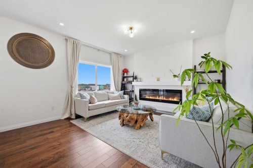 838 Edgefield Street, Strathmore, AB - Indoor Photo Showing Living Room With Fireplace