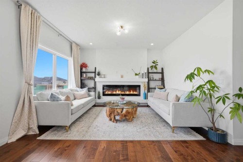 838 Edgefield Street, Strathmore, AB - Indoor Photo Showing Living Room With Fireplace