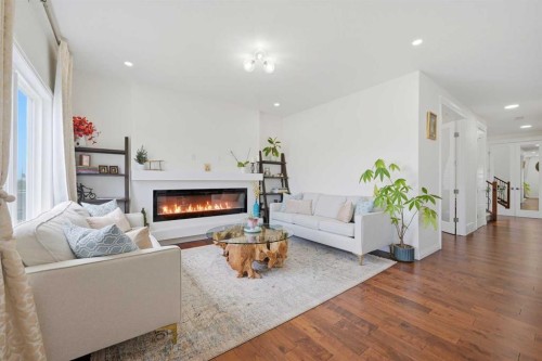 838 Edgefield Street, Strathmore, AB - Indoor Photo Showing Living Room With Fireplace