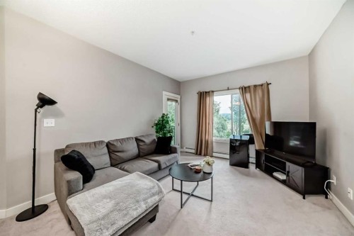 211-3950 46 Avenue Nw, Calgary, AB - Indoor Photo Showing Living Room
