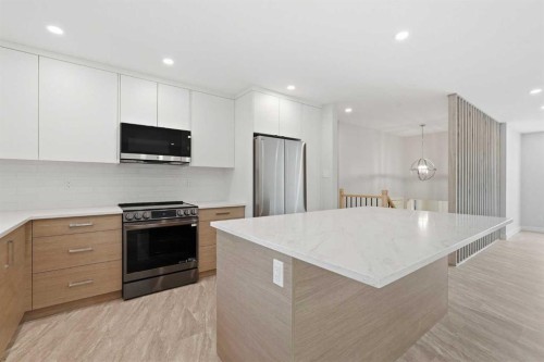 1018 10 Avenue Se, High River, AB - Indoor Photo Showing Kitchen With Upgraded Kitchen