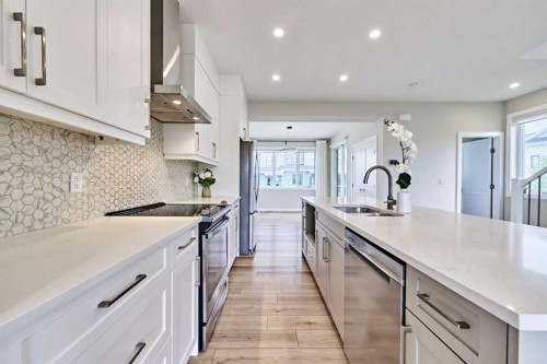 102 Crestridge Common Sw, Calgary, AB - Indoor Photo Showing Kitchen With Double Sink With Upgraded Kitchen