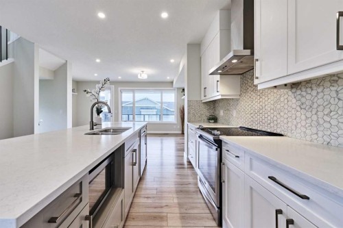102 Crestridge Common Sw, Calgary, AB - Indoor Photo Showing Kitchen With Double Sink With Upgraded Kitchen