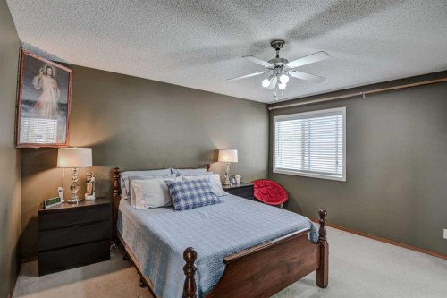 225 Chapala Drive Se, Calgary, AB - Indoor Photo Showing Bedroom