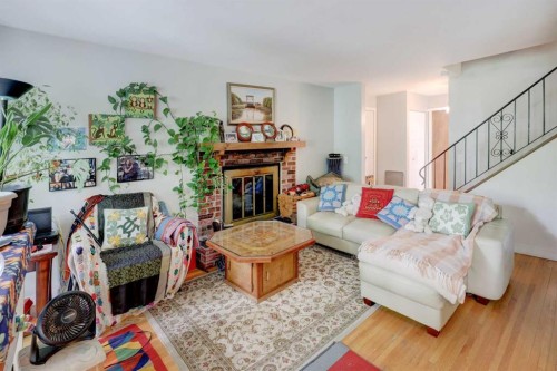 7624 34 Avenue Nw, Calgary, AB - Indoor Photo Showing Living Room With Fireplace