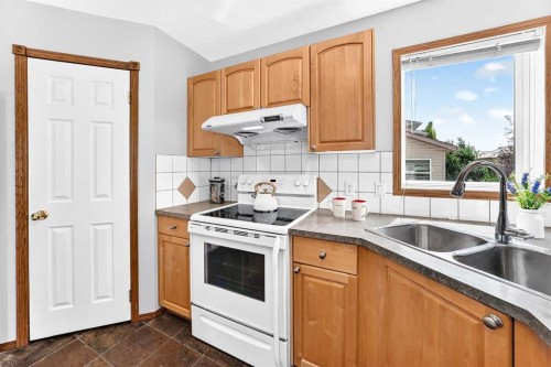 801 Panorama Hills Drive Nw, Calgary, AB - Indoor Photo Showing Kitchen With Double Sink