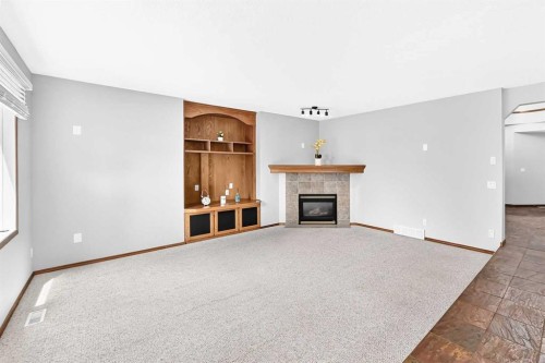 801 Panorama Hills Drive Nw, Calgary, AB - Indoor Photo Showing Other Room With Fireplace