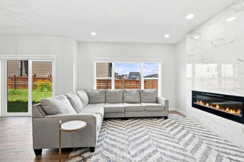 26 Homestead Circle Ne, Calgary, AB - Indoor Photo Showing Living Room With Fireplace
