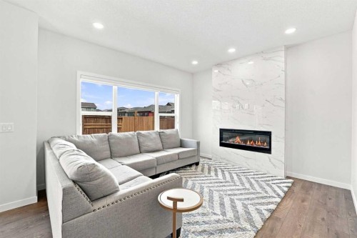 26 Homestead Circle Ne, Calgary, AB - Indoor Photo Showing Living Room With Fireplace