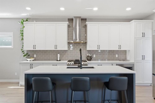 601 Reynolds Crescent Sw, Airdrie, AB - Indoor Photo Showing Kitchen With Upgraded Kitchen