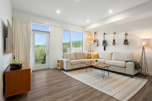 52 Na'A Heights Sw, Calgary, AB - Indoor Photo Showing Living Room