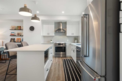 52 Na'A Heights Sw, Calgary, AB - Indoor Photo Showing Kitchen With Stainless Steel Kitchen With Upgraded Kitchen