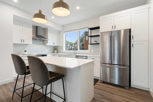 52 Na'A Heights Sw, Calgary, AB - Indoor Photo Showing Kitchen With Stainless Steel Kitchen With Upgraded Kitchen