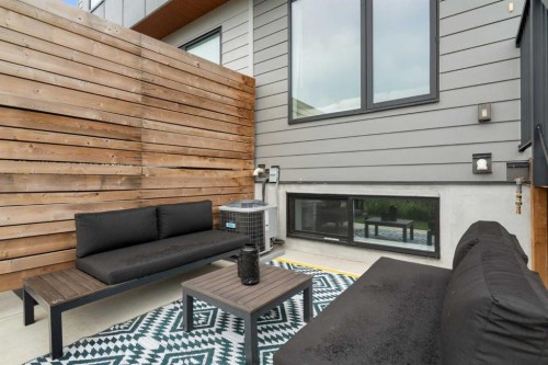 52 Na'A Heights Sw, Calgary, AB - Indoor Photo Showing Living Room With Fireplace