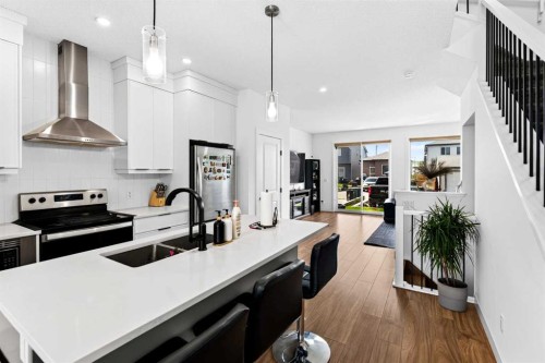 227 Chinook Gate Boulevard Sw, Airdrie, AB - Indoor Photo Showing Kitchen With Double Sink With Upgraded Kitchen