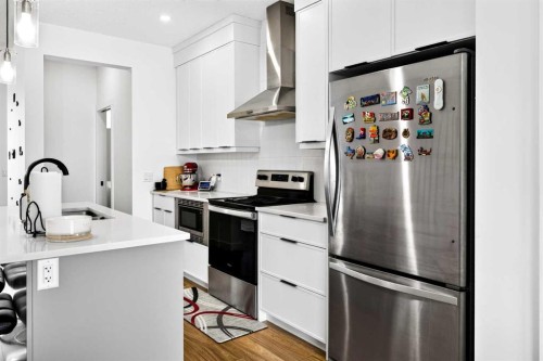 227 Chinook Gate Boulevard Sw, Airdrie, AB - Indoor Photo Showing Kitchen With Upgraded Kitchen