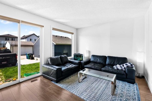 227 Chinook Gate Boulevard Sw, Airdrie, AB - Indoor Photo Showing Living Room