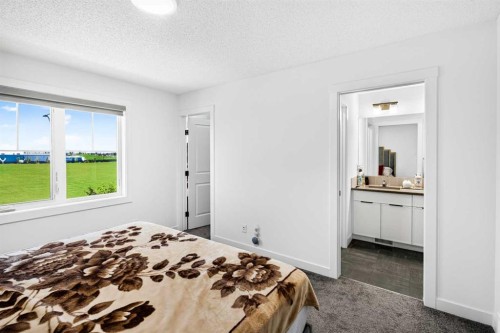 227 Chinook Gate Boulevard Sw, Airdrie, AB - Indoor Photo Showing Bedroom