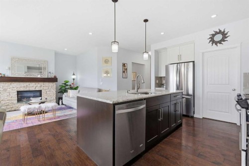 7 Auburn Crest Way Se, Calgary, AB - Indoor Photo Showing Kitchen With Fireplace With Stainless Steel Kitchen With Upgraded Kitchen