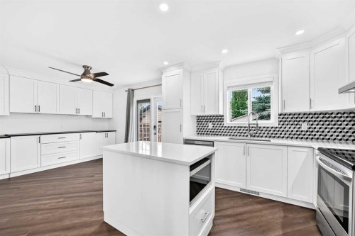 172 Cimarron Grove Crescent, Okotoks, AB - Indoor Photo Showing Kitchen With Upgraded Kitchen