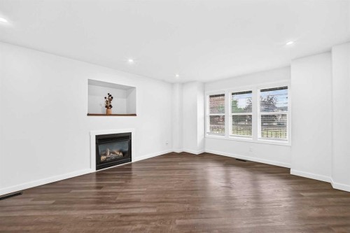 172 Cimarron Grove Crescent, Okotoks, AB - Indoor Photo Showing Living Room With Fireplace