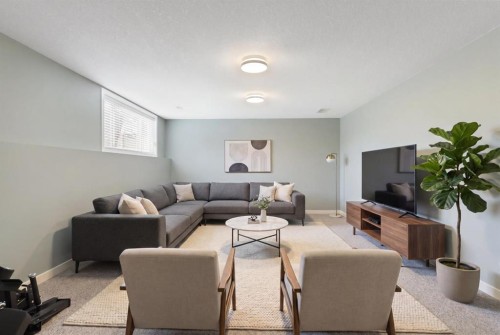 36 Jensen Heights Place Ne, Airdrie, AB - Indoor Photo Showing Living Room