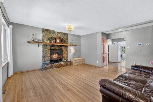 2018 Cottonwood Crescent Se, Calgary, AB - Indoor Photo Showing Living Room With Fireplace