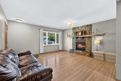 2018 Cottonwood Crescent Se, Calgary, AB - Indoor Photo Showing Living Room With Fireplace