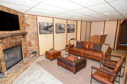 36 Cheyenne Crescent Nw, Calgary, AB - Indoor Photo Showing Living Room With Fireplace