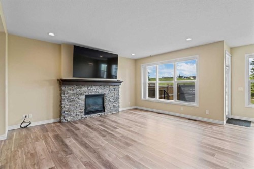 284 Nolancrest Heights Nw, Calgary, AB - Indoor Photo Showing Living Room With Fireplace
