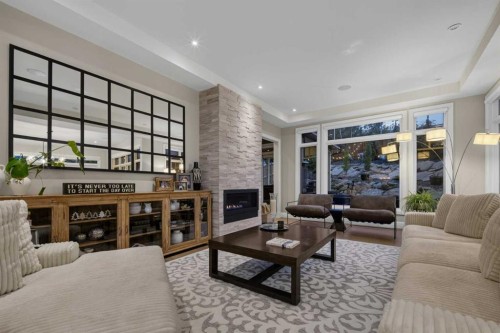 11 Elveden Place Sw, Calgary, AB - Indoor Photo Showing Living Room With Fireplace