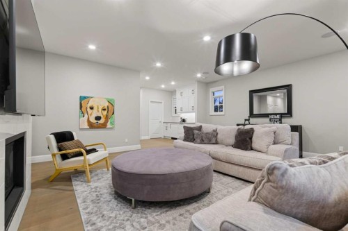 11 Elveden Place Sw, Calgary, AB - Indoor Photo Showing Living Room With Fireplace