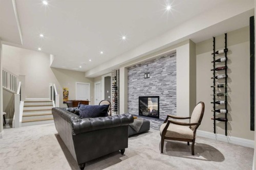 11 Elveden Place Sw, Calgary, AB - Indoor Photo Showing Living Room With Fireplace