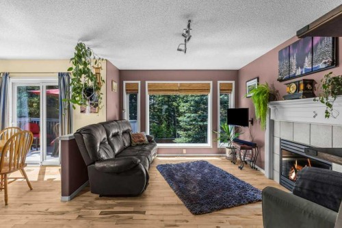 545 Grotto Road, Canmore, AB - Indoor Photo Showing Living Room With Fireplace