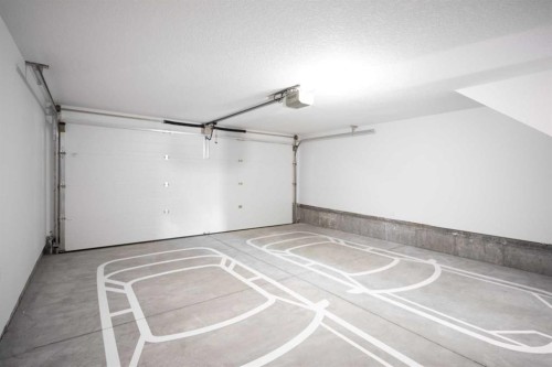 86 Heirloom Passage Se, Calgary, AB - Indoor Photo Showing Garage