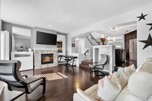 213 Auburn Meadows Way Se, Calgary, AB - Indoor Photo Showing Living Room With Fireplace