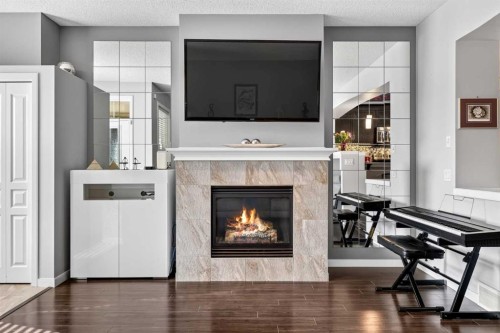 213 Auburn Meadows Way Se, Calgary, AB - Indoor Photo Showing Living Room With Fireplace