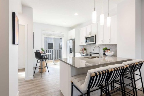 90 Heirloom Passage Se, Calgary, AB - Indoor Photo Showing Kitchen With Double Sink With Upgraded Kitchen