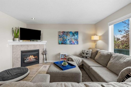 71 Royal Birch Manor Nw, Calgary, AB - Indoor Photo Showing Living Room With Fireplace