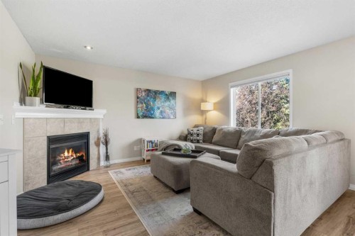 71 Royal Birch Manor Nw, Calgary, AB - Indoor Photo Showing Living Room With Fireplace