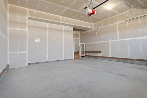 358 Kinniburgh Loop, Chestermere, AB - Indoor Photo Showing Garage