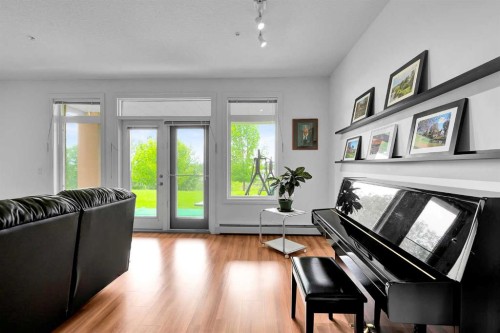 2105-10221 Tuscany Boulevard Nw, Calgary, AB - Indoor Photo Showing Living Room