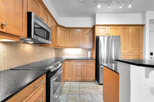 2105-10221 Tuscany Boulevard Nw, Calgary, AB - Indoor Photo Showing Kitchen With Stainless Steel Kitchen